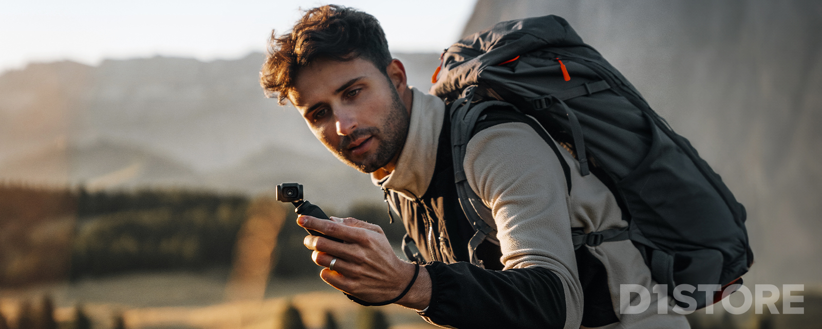 Man filming with the Osmo Pocket 3 gimbal camera